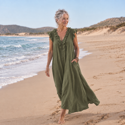 Bondi Chiara Maxi Dress in moss green, worn barefoot on the beach